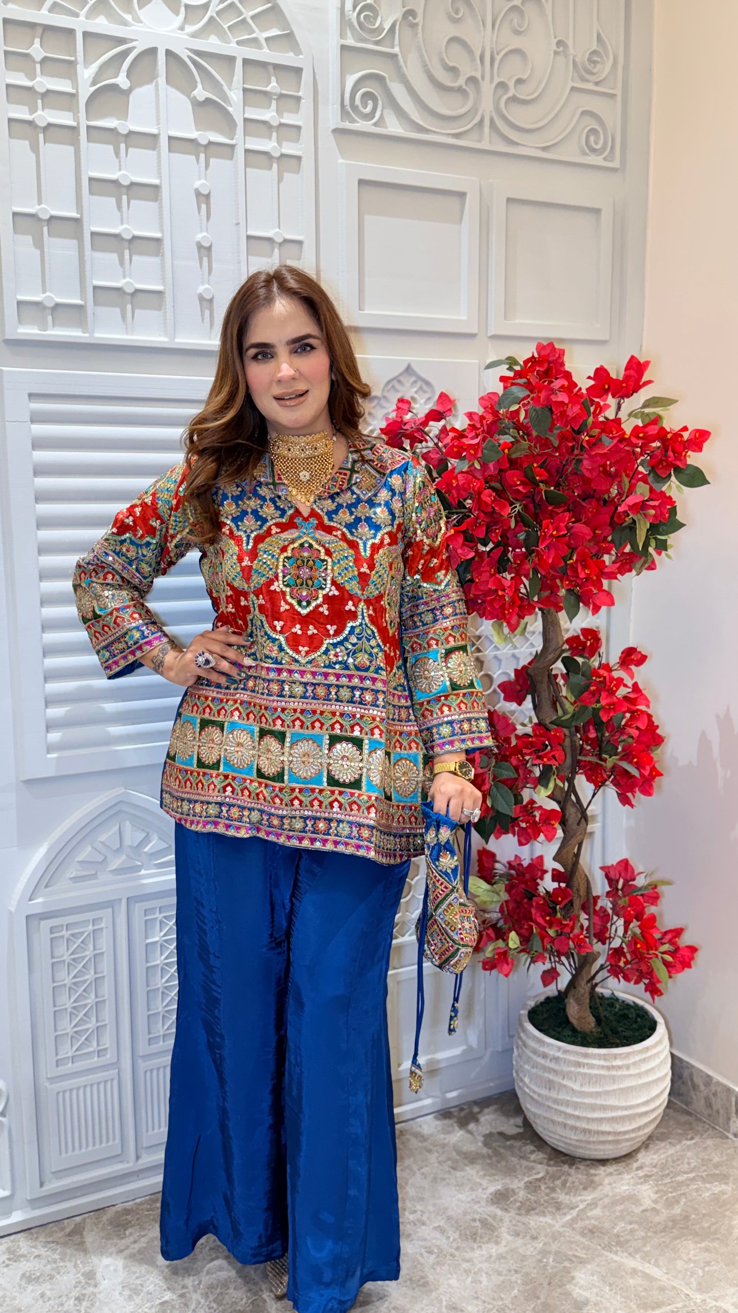 Elegant two-piece kurta set with matching red sharara pants. PC3385
