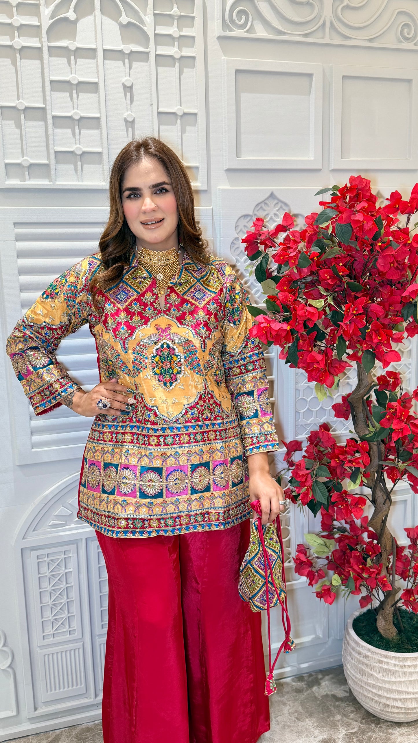 Elegant two-piece kurta set with matching red sharara pants. PC3385