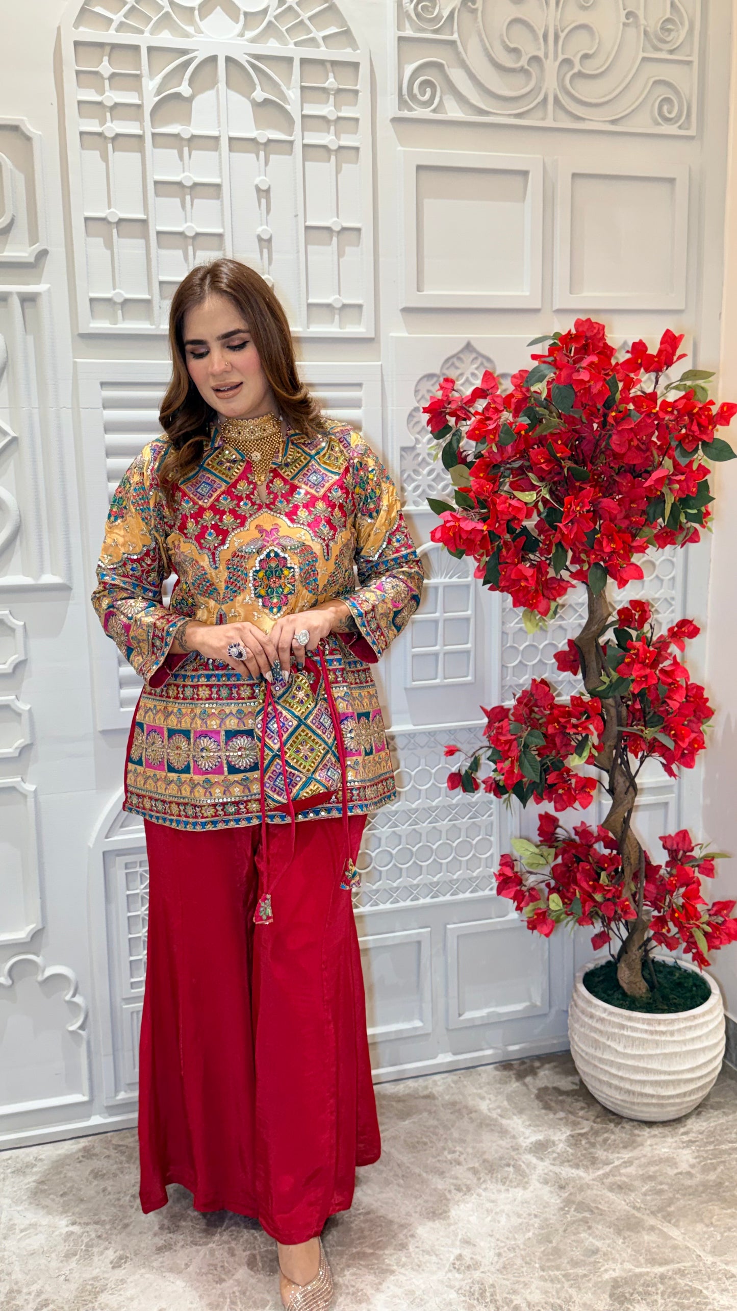 Elegant two-piece kurta set with matching red sharara pants. PC3385