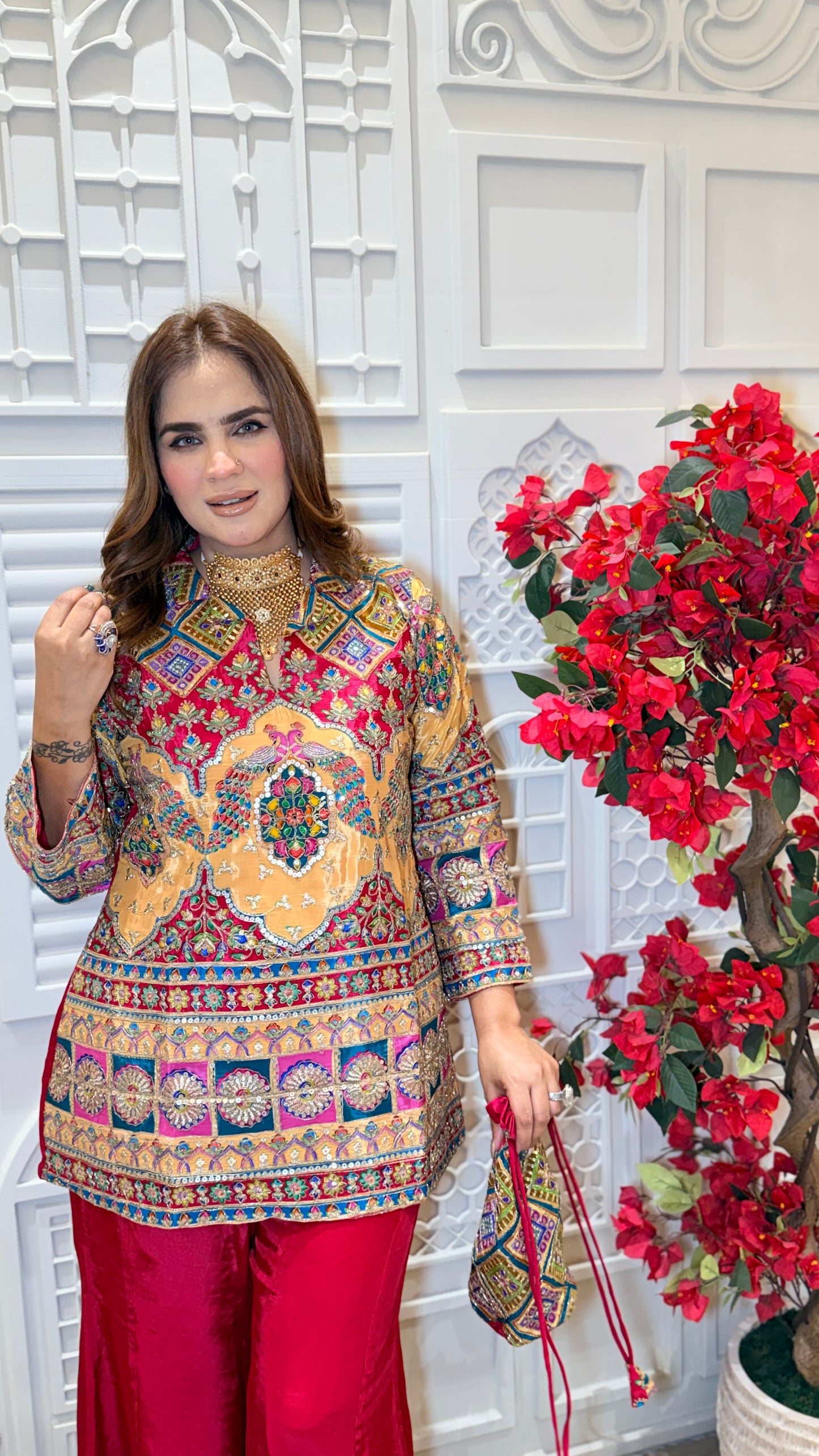 Elegant two-piece kurta set with matching red sharara pants. PC3385